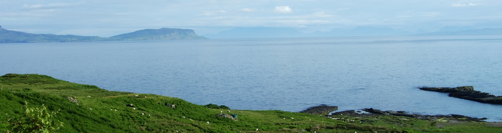 Islands of Eigg & Skye from Air an Oir Ardnamurchan Scotland