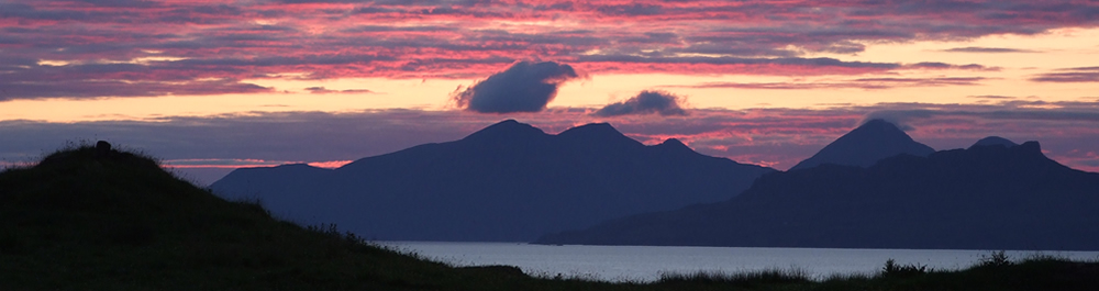 Sunset showing Islands of Eigg, Rhum & Muck from Self catering holiday house Ardnamurchan Scotland